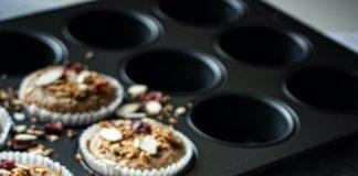 cupcakes on round tray beside clear glass bowls
